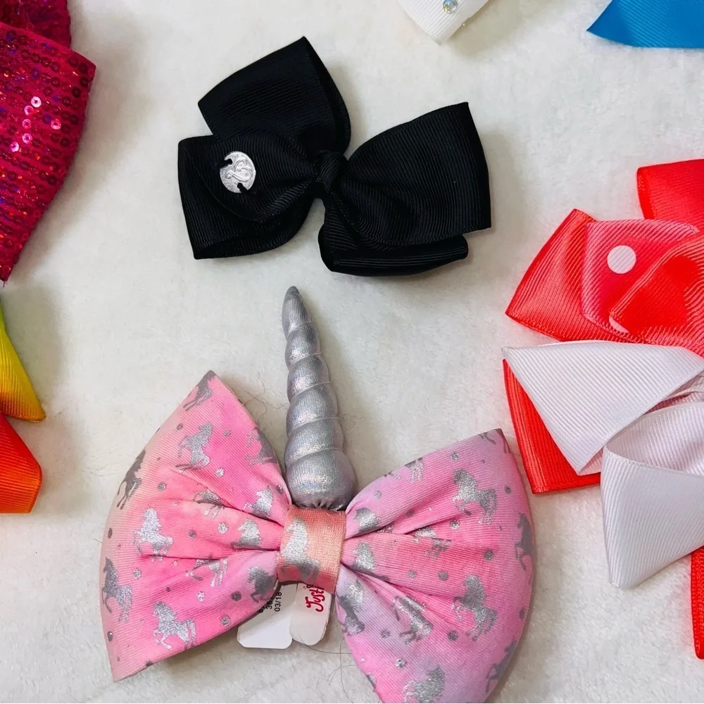 7 Cheerleader/Dance Bows Different Sizes, Colors & Holders. Missing Black Bow